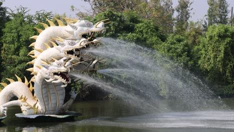 water sprays from dragon sculpture fountain