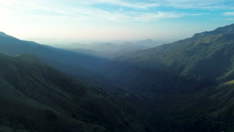 Aerial-drone-landscape-of-morning-sunrise-with-clouds-in-sky-and-scenic-mountains-greenery-nature-hills-in-Ella-Sri-Lanka-travel-tourism-hiking-Asia