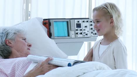 little girl speaking to her grandmother