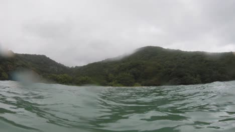 pov shot of con dao island in vietnam, captured using a gopro from a water surface