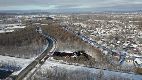 Forest-Destruction-by-construction,-turn-around-in-winter