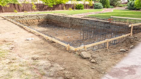 4k Looping Seamless Cinemagraph of Swimming Pool Construction Fading to Completed Pool