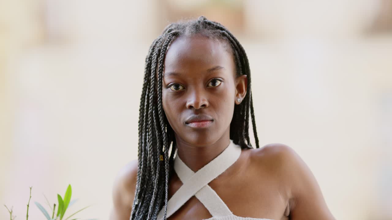 Portrait of a Young Black Woman with Braids