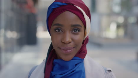 portrait young african american business woman smiling enjoying successful urban lifestyle beautiful black muslim female wearing traditional hijab headscarf in city