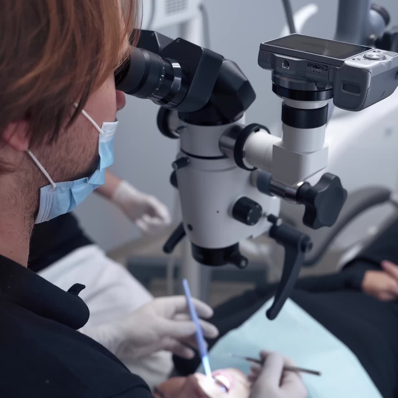 Dentist at work with patient
