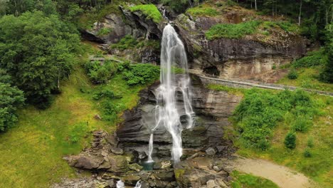 Steinsdalsfossen-is-a-waterfall-in-the-village-of-Steine-in-the-municipality-of-Kvam-in-Hordaland-county,-Norway.-The-waterfall-is-one-of-the-most-visited-tourist-sites-in-Norway.