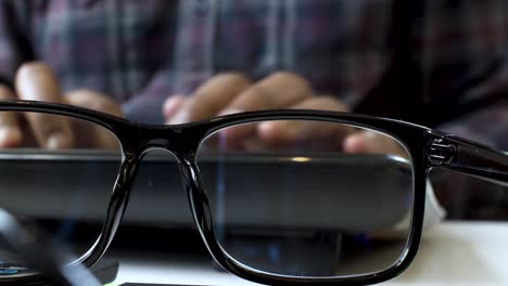 Glasses in Black Frame, Closeup of Hands Typing on Keyboard