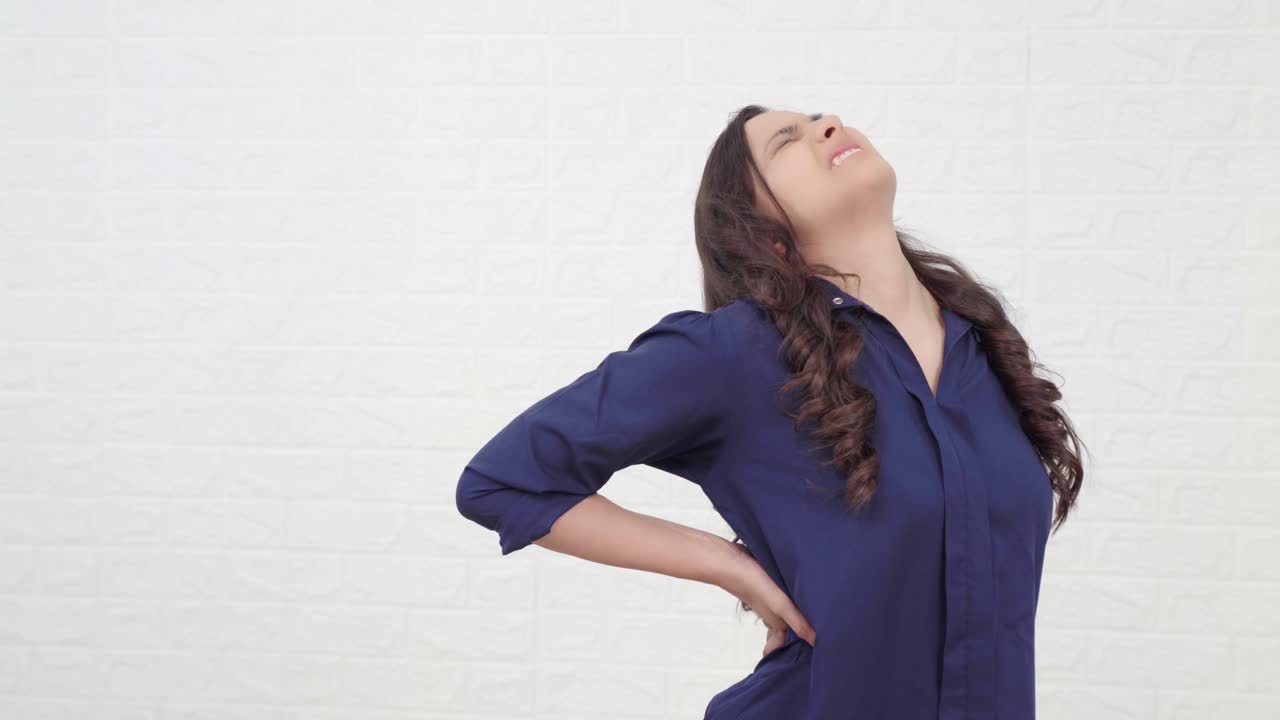 Young indian girl having Back pain