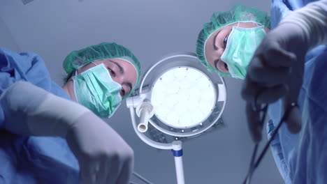 women performing surgery in hospital together