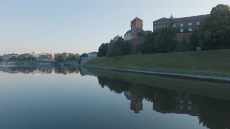 aerial drone shot of krakow poland wawel castle old town with the river vistula at sunrise