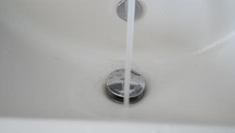 water running in a bathroom sink