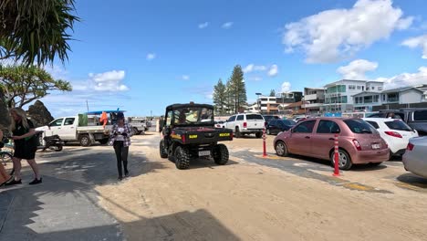 people and vehicles near currumbin beach, gold coast