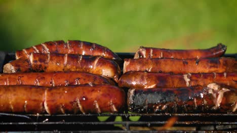 delicious fried sausages on home barbecue