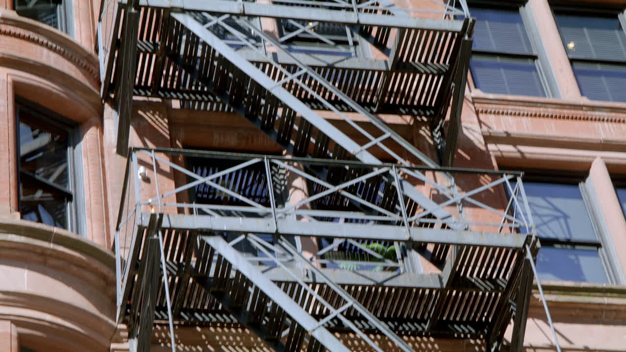 Classic Brick Building with Fire Escape and Bay Window
