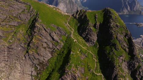 establishing aerial view above steps to reinebringen mountain summit