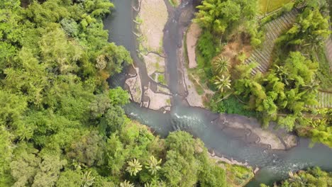 aerial footage over the elo river and the jungle in central java, indonesia