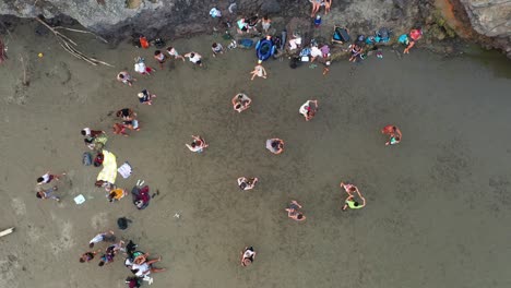 birds eye view of people latin dancing on sand.
