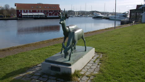 shot of a statue of 2 deers raindeers at kristiansand harbour