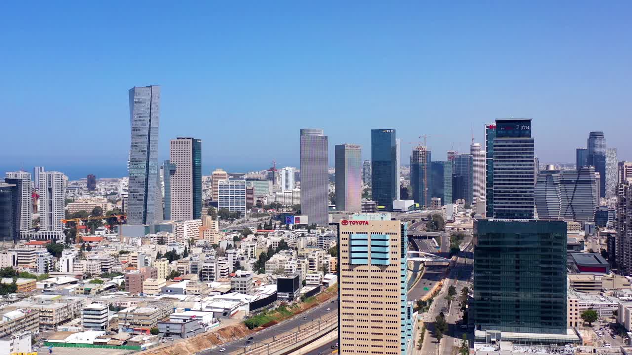 Aerial view of Tel Aviv city skyline with modern skyscrapers and highways