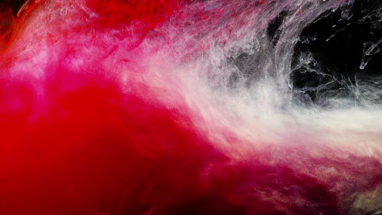Abstract forms. Shooting on a black background. Mixing of paints