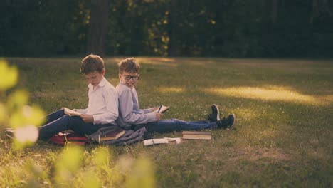 schoolmates prepare for exams together in spring sunny park