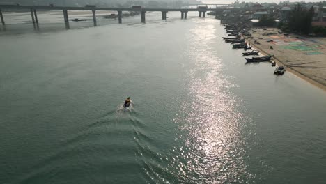river, bridge, and fishing village
