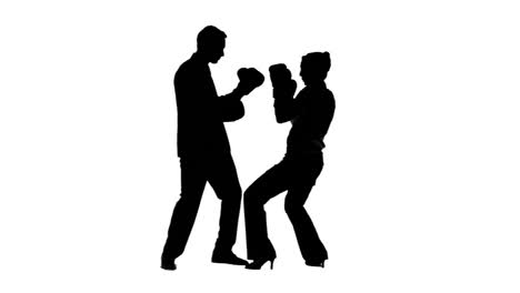 silhouettes of colleagues in slow motion boxing