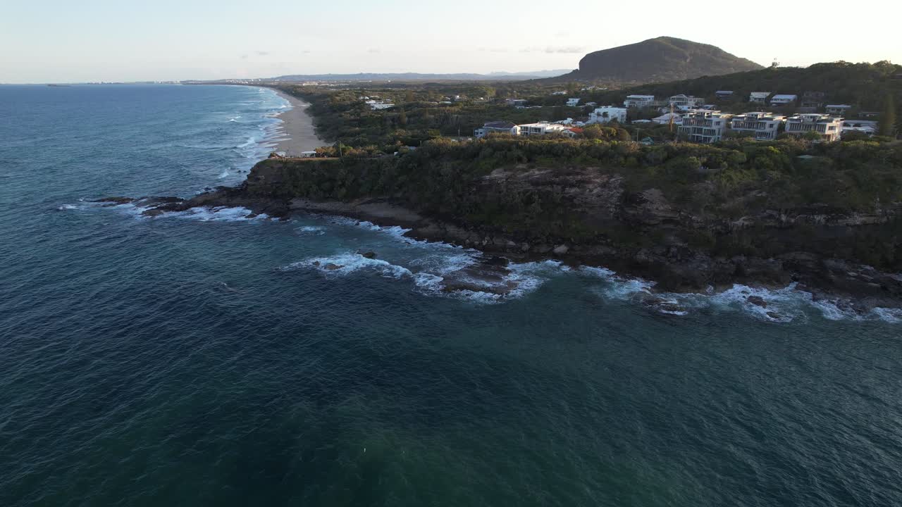 Waves Crashing Against The Rocky Cliffs Of Point Arkwright In QLD, Australia. - aerial shot