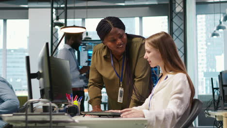 manager supervising young trainee in office using ai technology