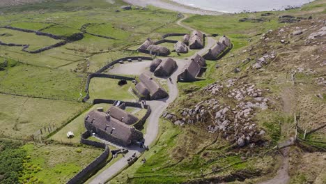 bids-eye-view drone shot of the gearrannan blackhouse village on the isle of lewis, part of the outer hebrides of scotland