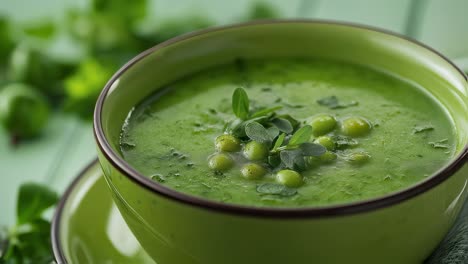 vibrant green pea soup gently rotating, garnished with fresh pea sprouts, presenting creamy texture and appetizing appearance in matching green ceramic bowl and plate
