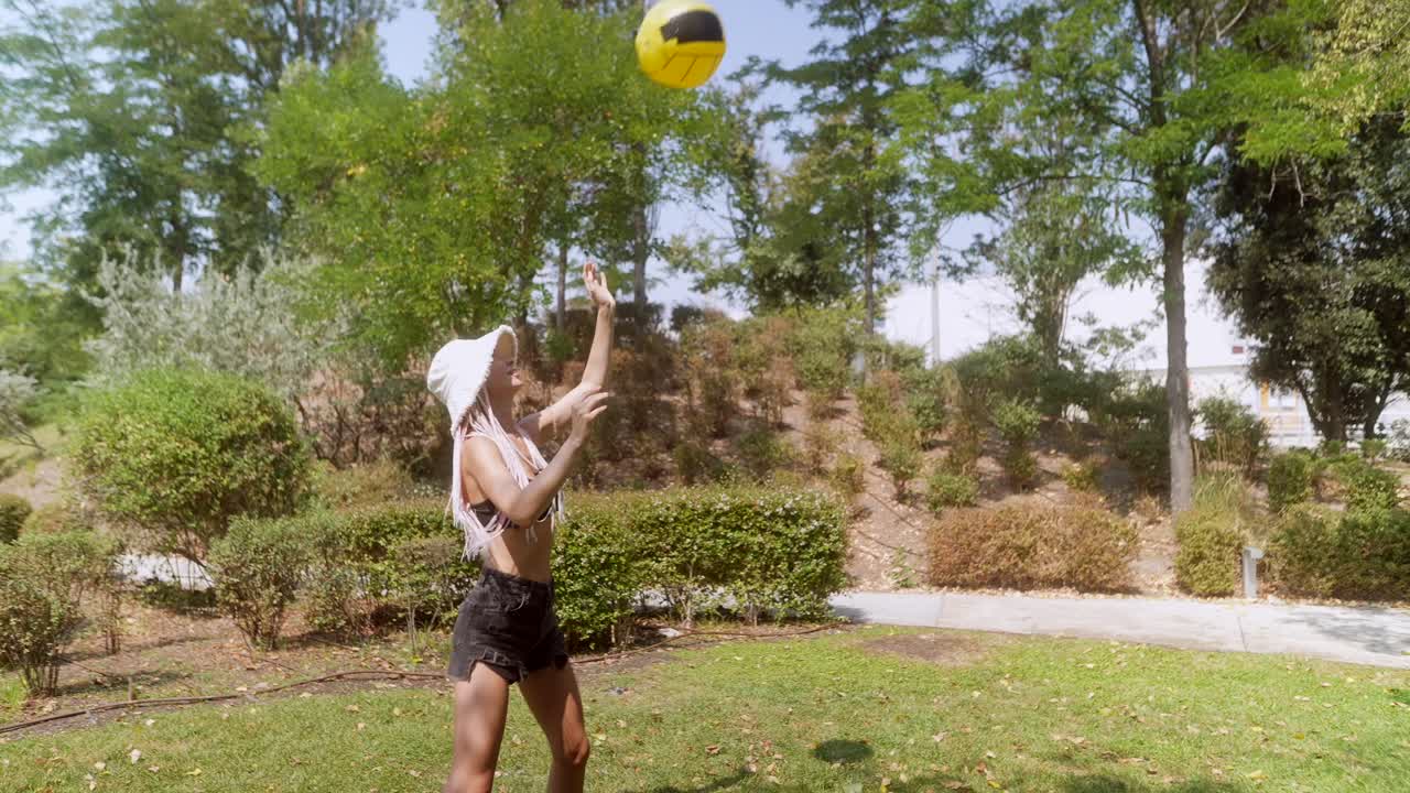 People playing with a ball in the park