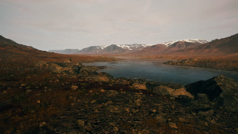 Atmospheric-landscape-with-mountain-lake-among-moraines-in-rainy-weather