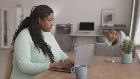 young african businesswoman working on computer