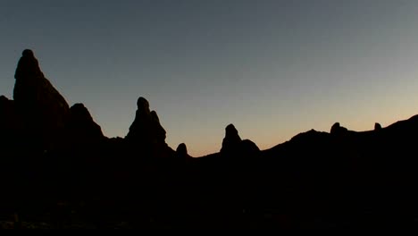 the trona pinnacles are silhouetted against the dawn