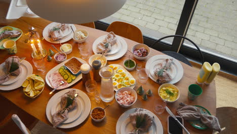 elegantly set table with a spread of scandinavian dishes, ready for a feast