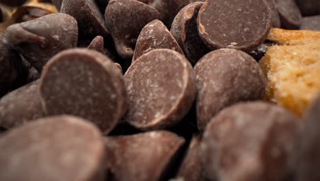 chocolate chip and cookie tower with chocolate chips falling macro close up pull away 4k food product video