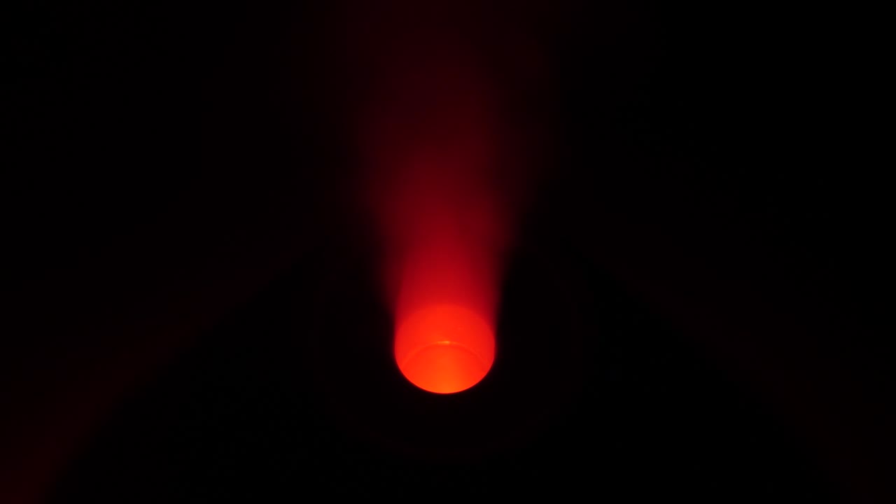working a humidifier with a red circular light in the middle