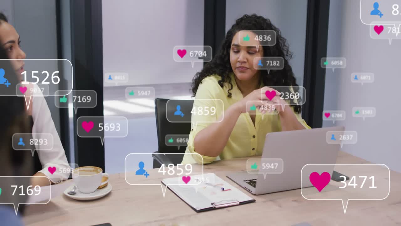 Mid adult woman in yellow shirt using laptop in business meeting, showing social media metrics