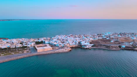 aerial view of a coastal town at dusk