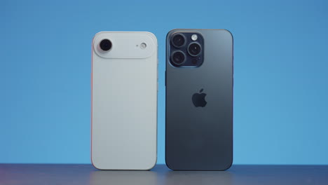 two smartphones side-by-side, showcasing different designs and camera setups