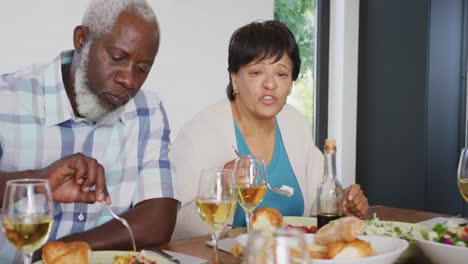 Happy-senior-diverse-people-having-dinner-at-retirement-home