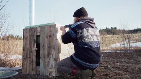 Man-Putting-Wood-Support-For-His-DIY-Hot-Tub---Close-Up