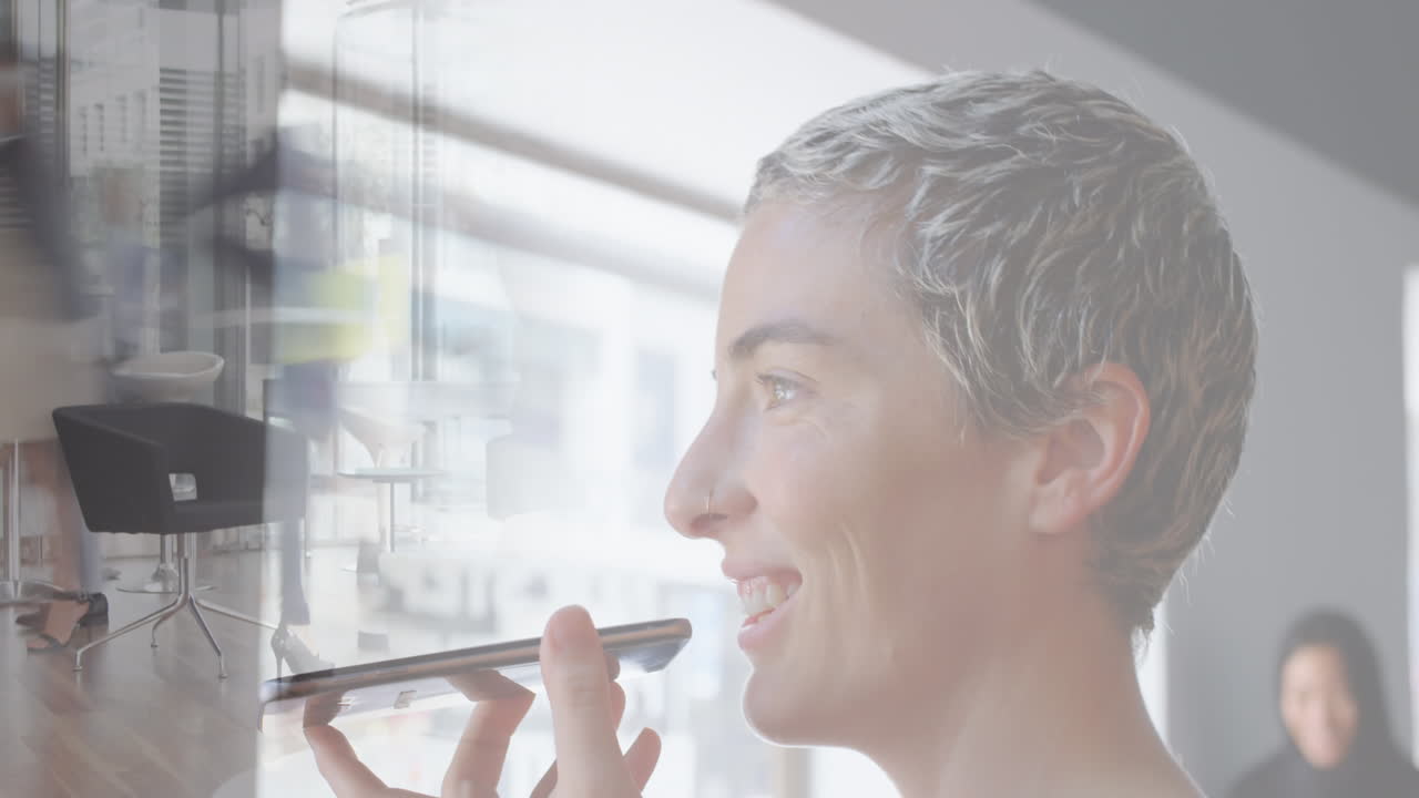 Animation of caucasian businesswoman on phone over cityscape