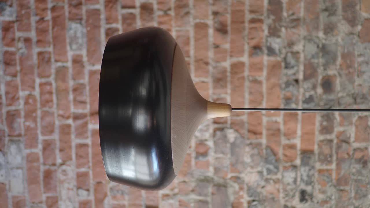 Lamp against a brick wall