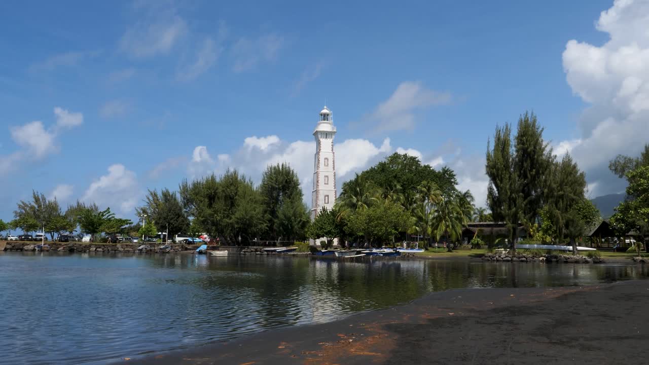 Point Venus historic lighthouse and the famous black sand beach in Matavai Bay, Tahiti, French Polynesia.