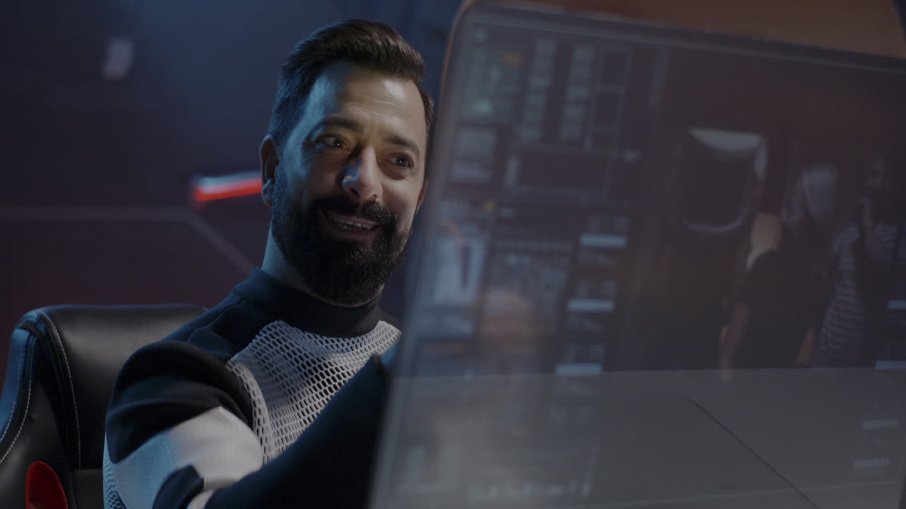 Smiling Man Working on Computer