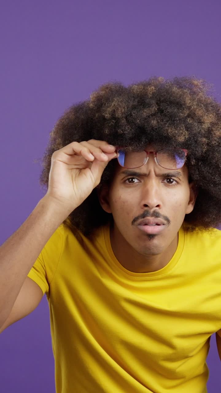 Man with Afro and Glasses Expressing Various Emotions