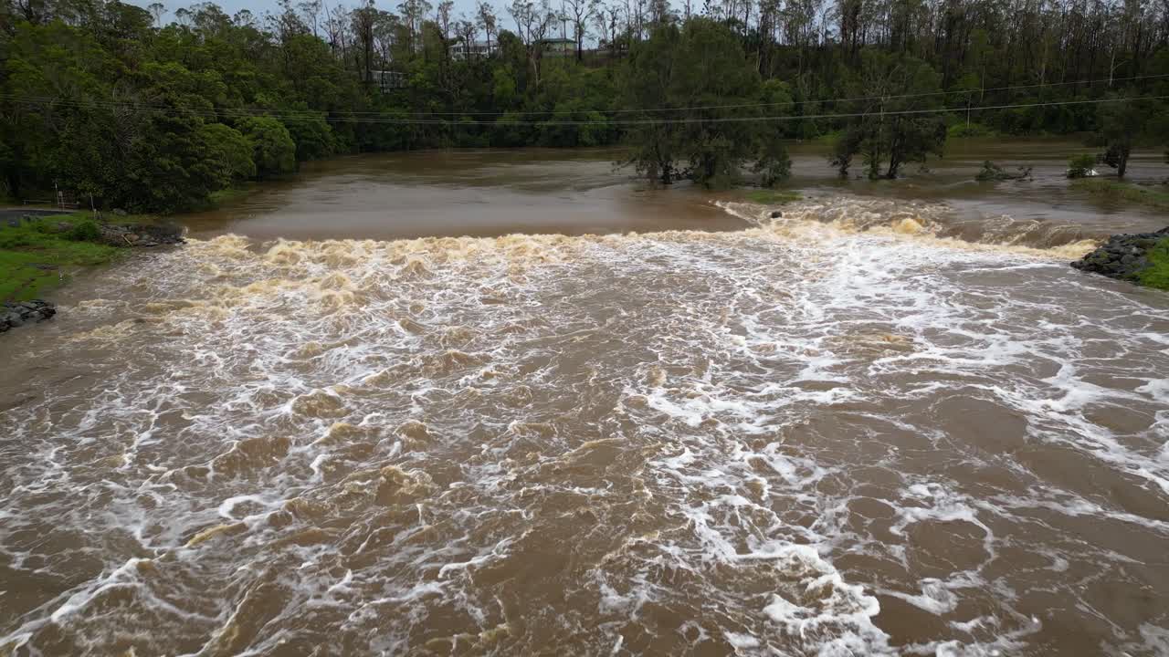 Coomera, Gold Coast, 2 January 2024 - Aerial view of Coomera River Causeway under flood waters from the 2024 Storms in January