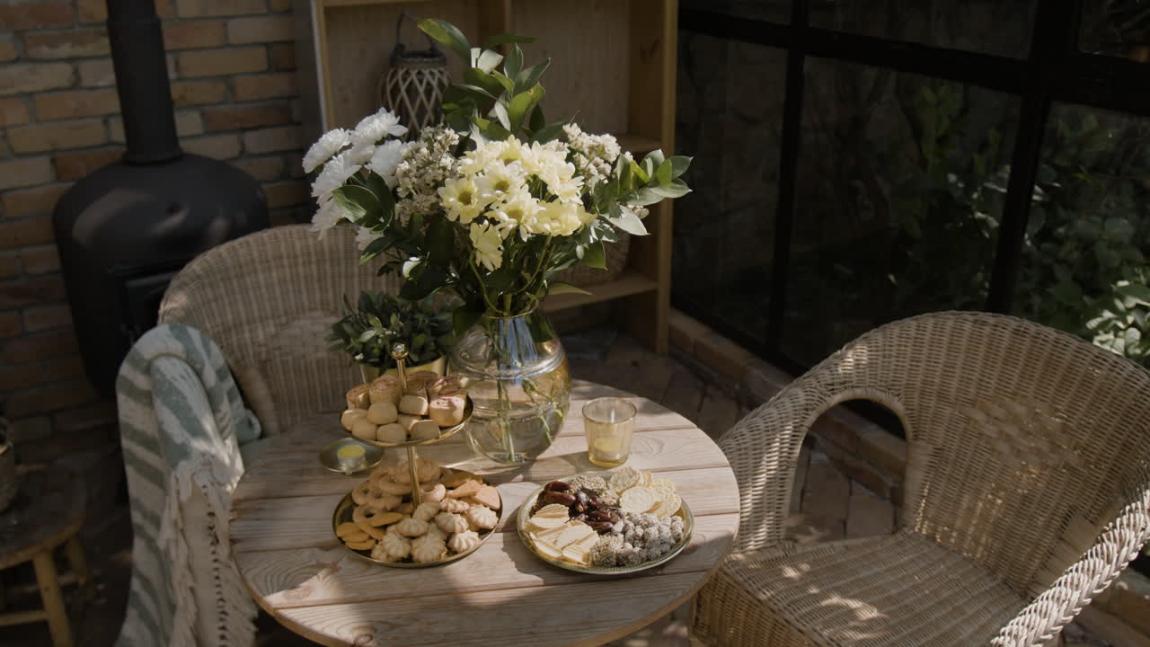 Cozy Patio Snack Table with Flowers and Treats